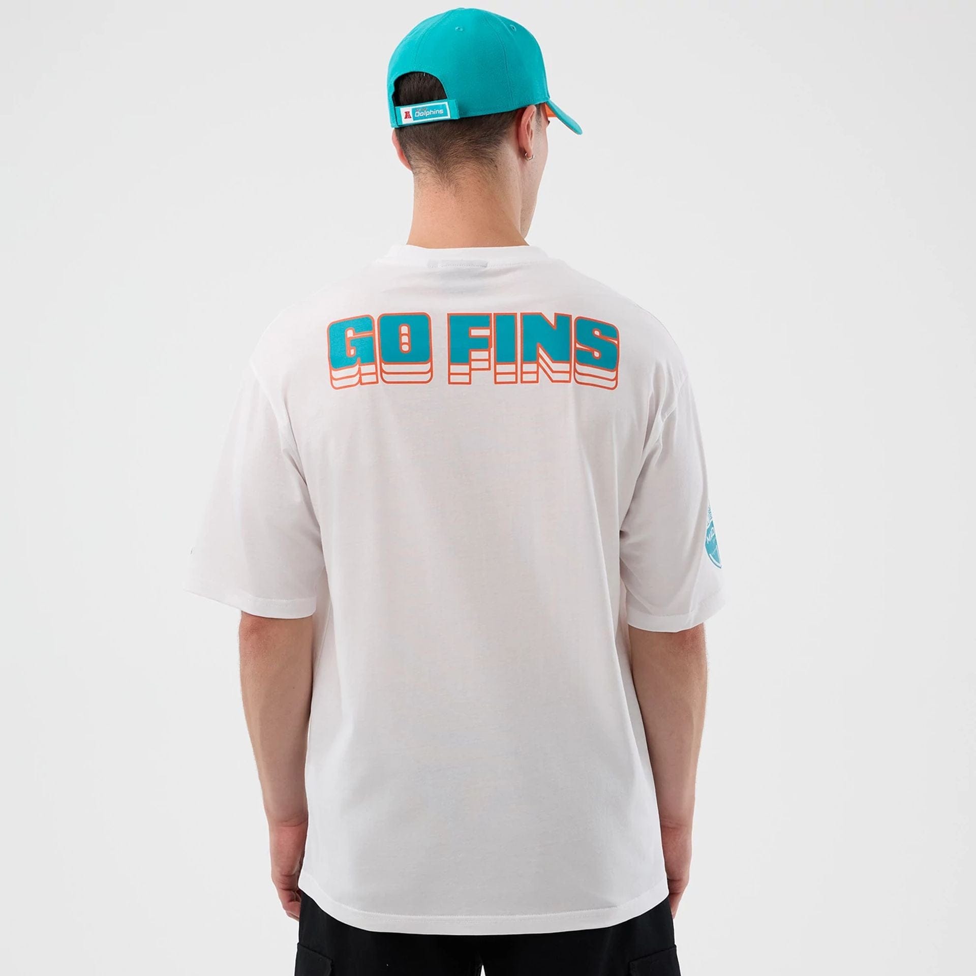 The Male model is wearing Miami Dolphins NFL International Series Games White Oversized T-Shirt  2