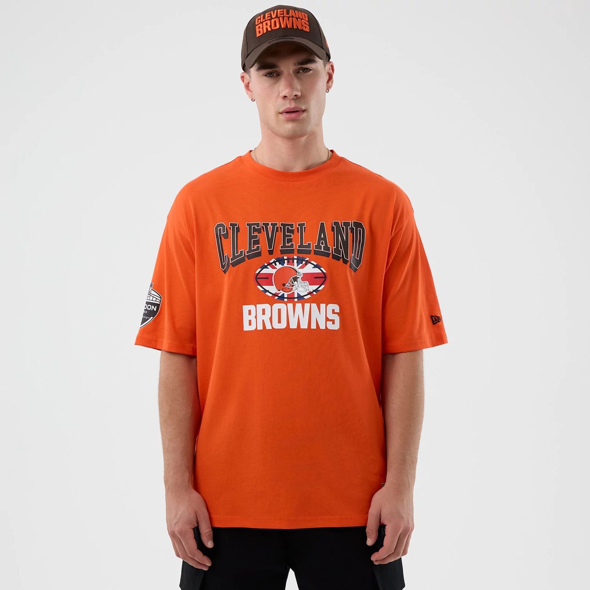 The Male model is wearing Cleveland Browns NFL International Series Games Orange Oversized T-Shirt  1