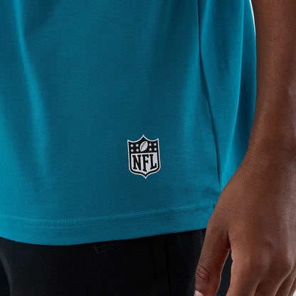The Male model is wearing Jacksonville Jaguars NFL International Series Games Turquoise Oversized T-Shirt 5