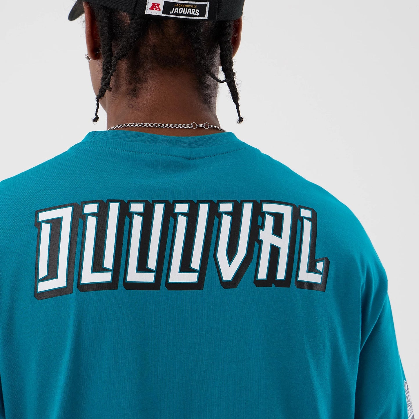 The Male model is wearing Jacksonville Jaguars NFL International Series Games Turquoise Oversized T-Shirt 6