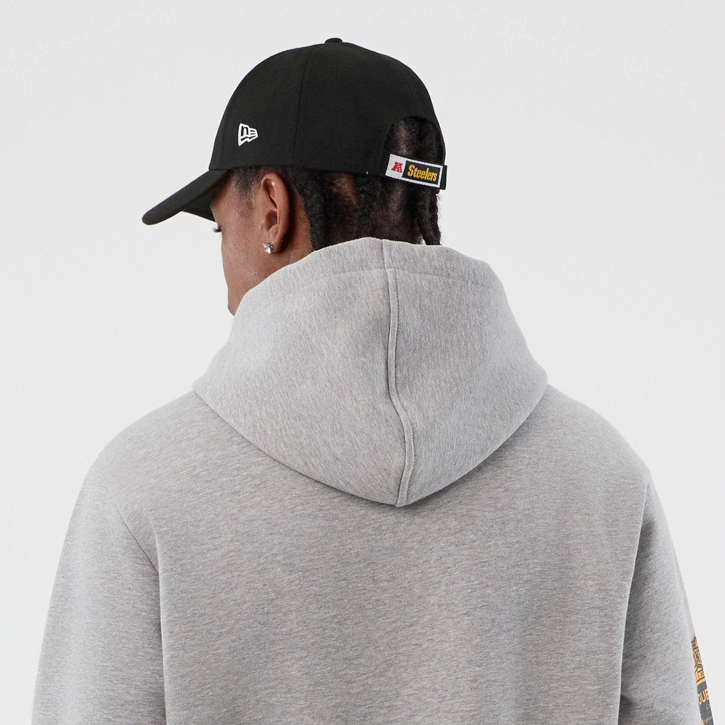 The Male model is wearing Pittsburgh Steelers NFL International Series Games Grey Pullover Hoodie  7