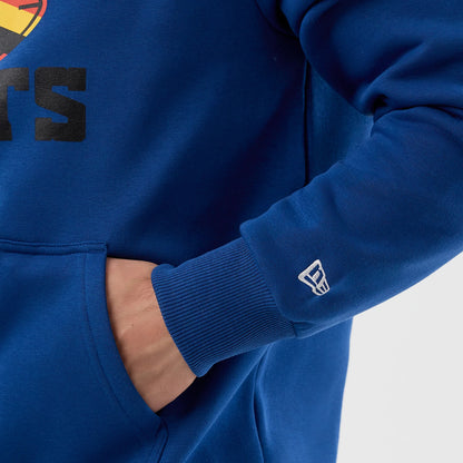 New Era Indianapolis Colts NFL International Series Games Blue Pullover Hoodie, front view showing the blue colour with a pocket on the side, ribbed cuffs on the sleeves, and a small embroidered New Era logo above the left wrist.