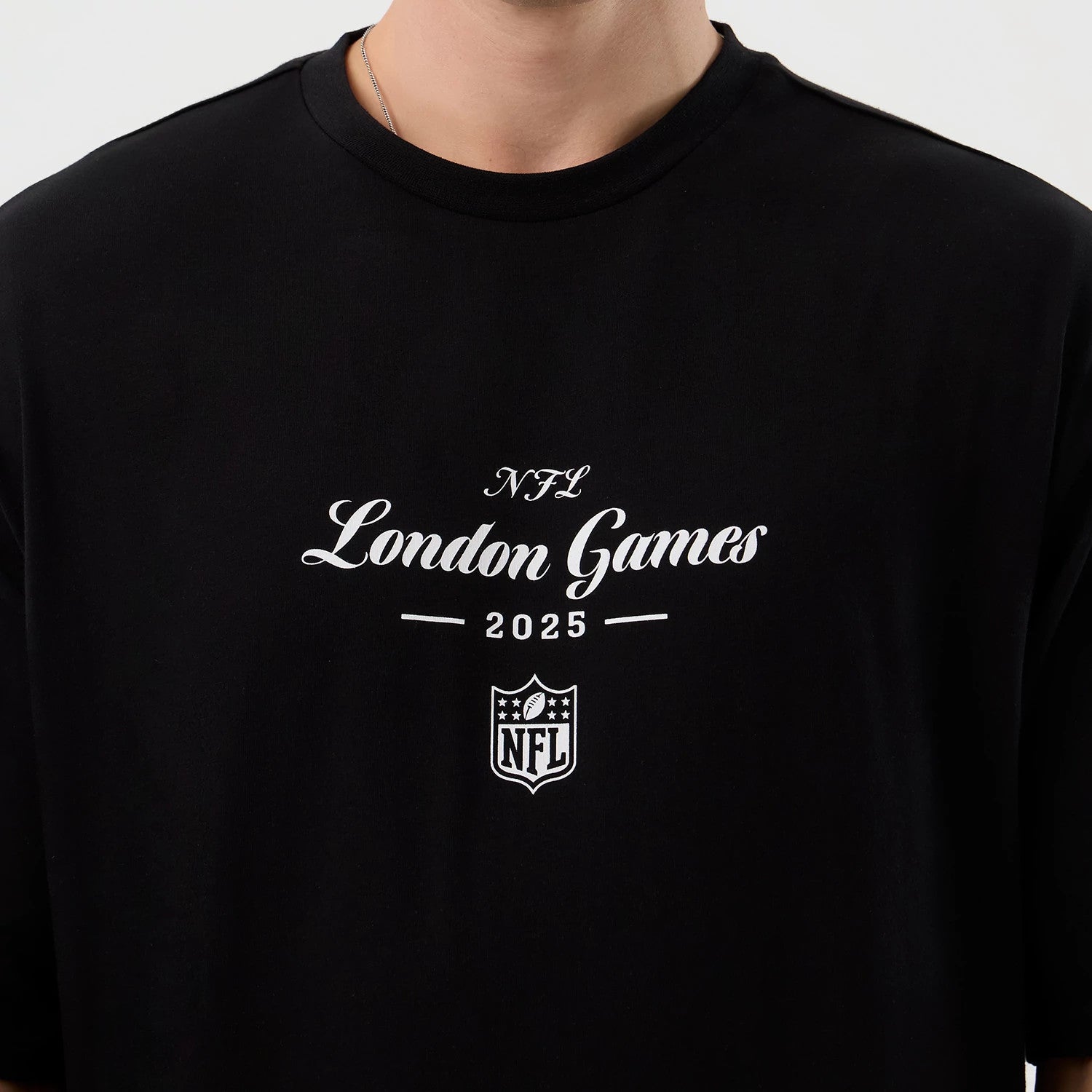 The Male model is wearing London Games NFL International Series Games Black Oversized T-Shirt 3