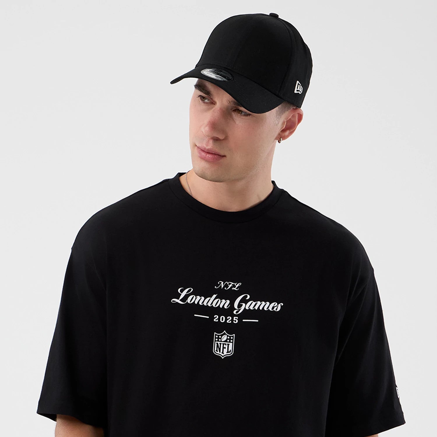 The Male model is wearing London Games NFL International Series Games Black Oversized T-Shirt 6
