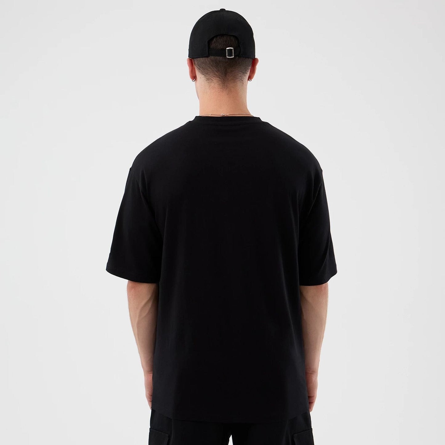 The Male model is wearing London Games NFL International Series Games Black Oversized T-Shirt  2