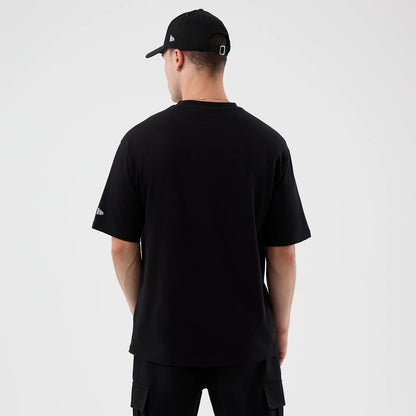 The Male model is wearing Madrid Game NFL International Series Games Black Oversized T-Shirt 2