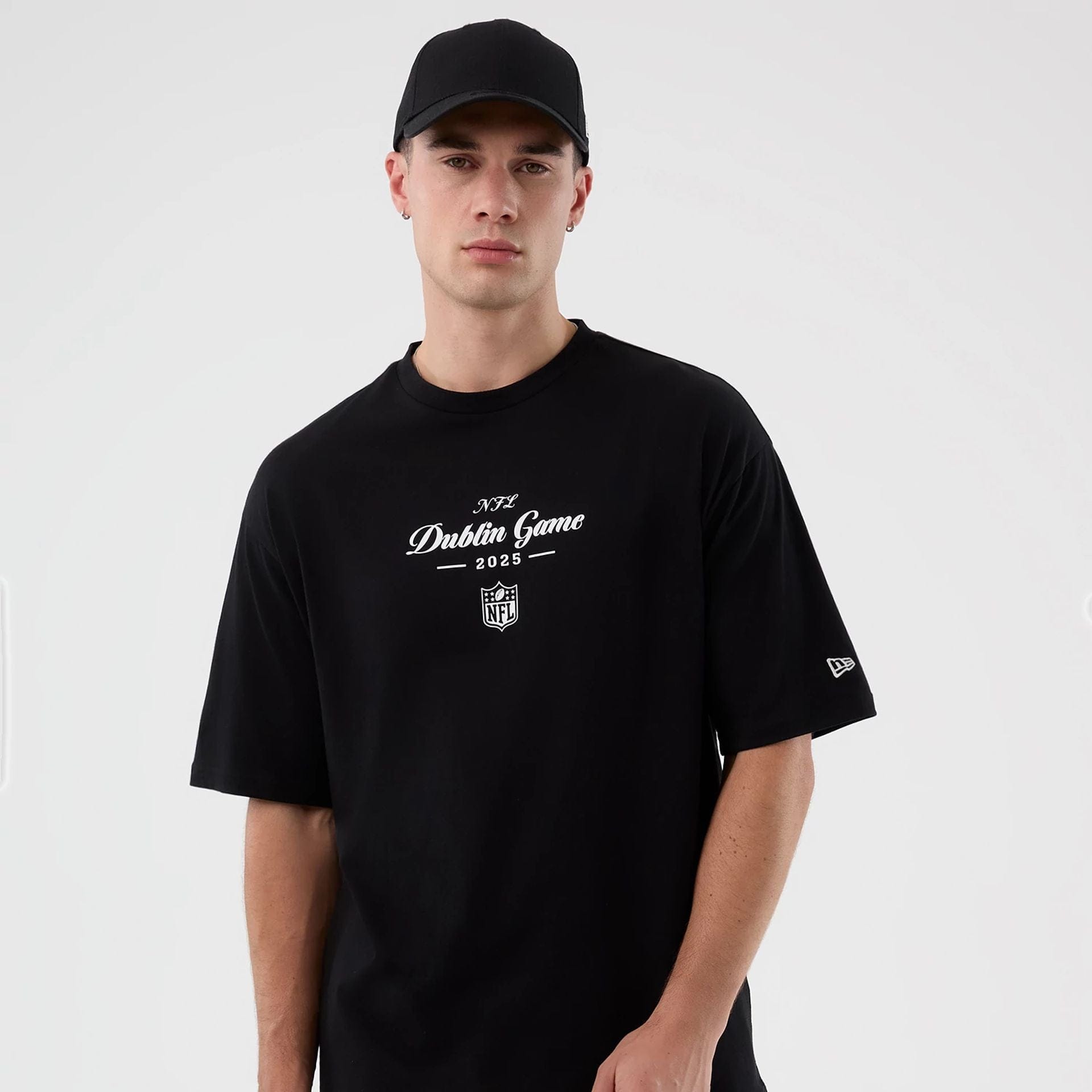 The Male model is wearing Dublin Game NFL International Series Games Black Oversized T-Shirt  5