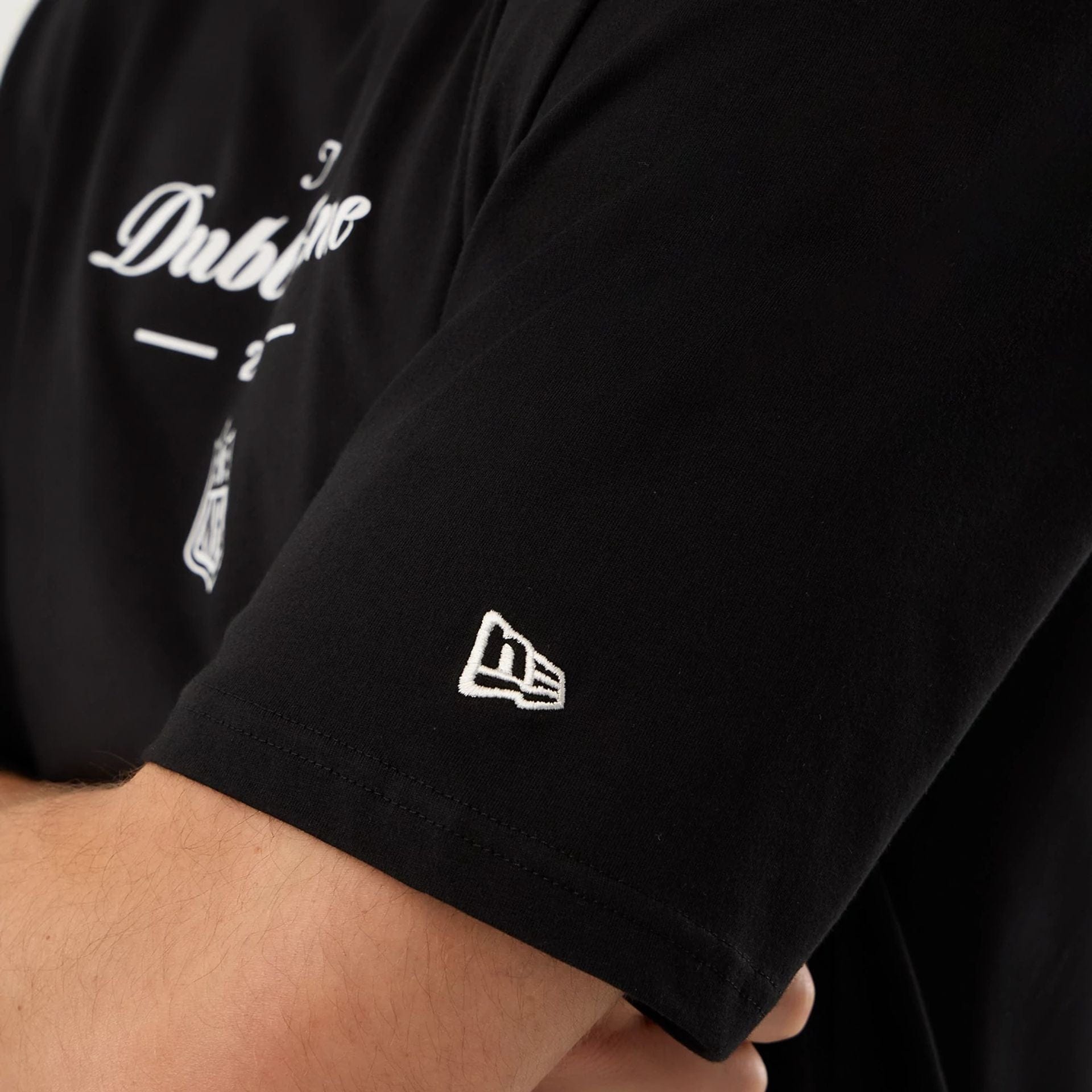 The Male model is wearing Dublin Game NFL International Series Games Black Oversized T-Shirt  4