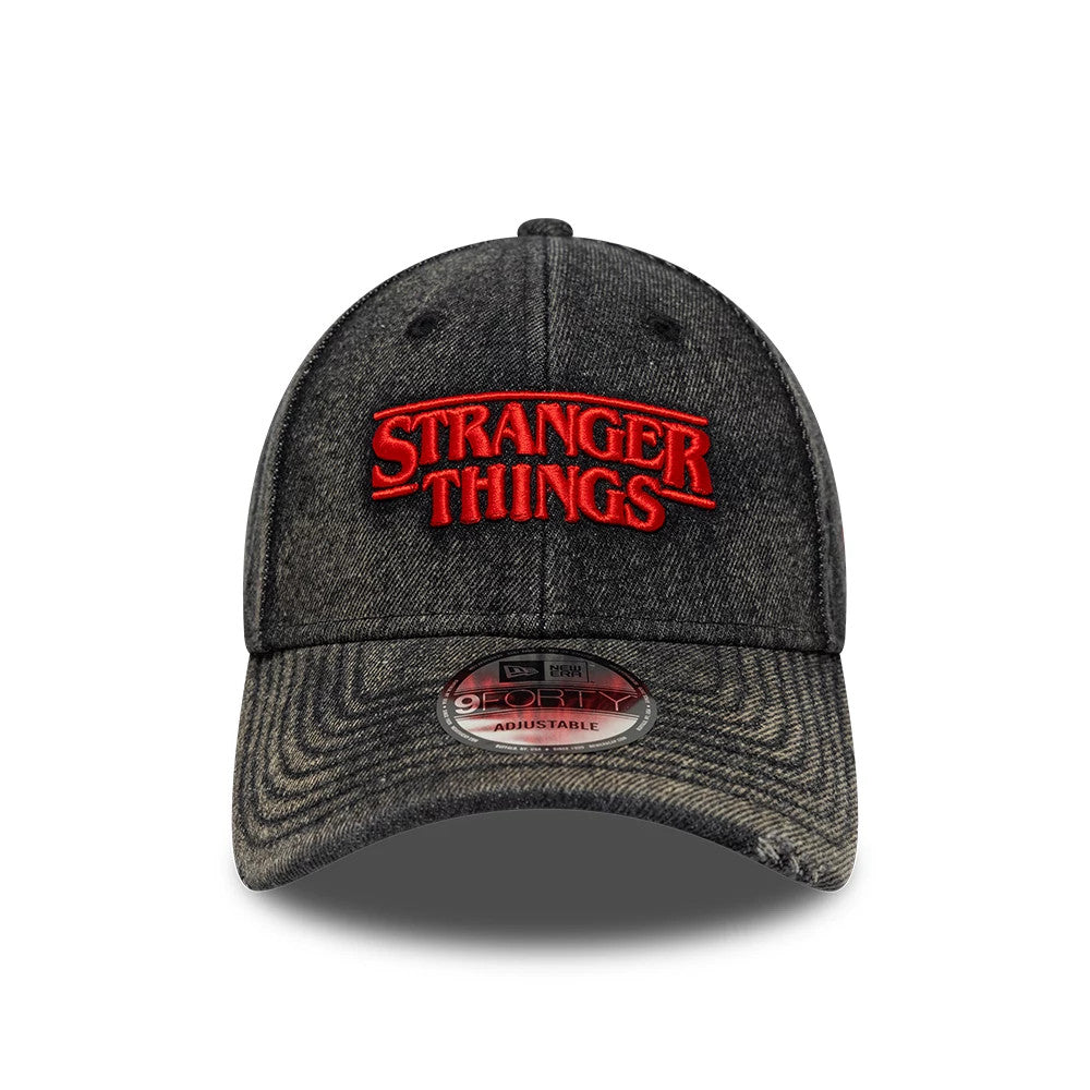 Stranger Things Distressed Black New Era 9FORTY Adjustable Cap, front view showing the raised red embroidered Stranger Things logo on the black distressed crown, with the 9FORTY size sticker on the curved visor.