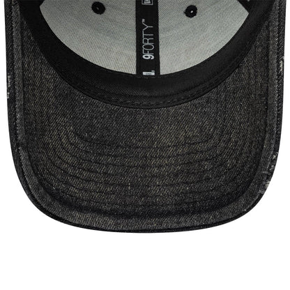Stranger Things Distressed Black New Era 9FORTY Adjustable Cap, inside view showing grey taping with New Era branding, black sweatband, and a dark distressed undervisor with stitching detail.