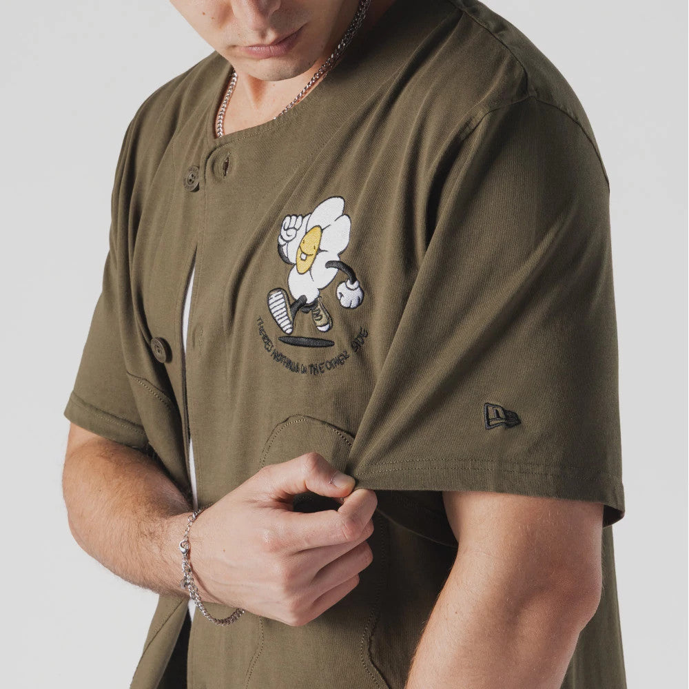 The Male model is wearing  New Era x Rodrigo Roji Flower Green Jersey 3