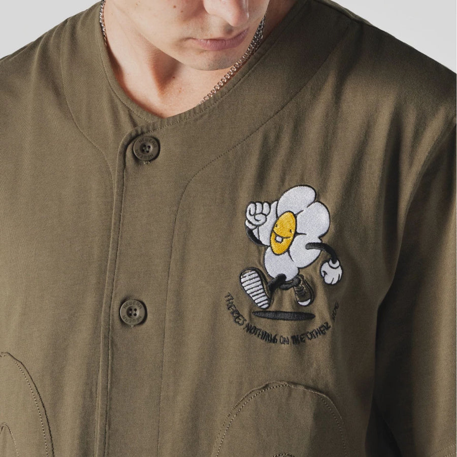 The Male model is wearing  New Era x Rodrigo Roji Flower Green Jersey  4