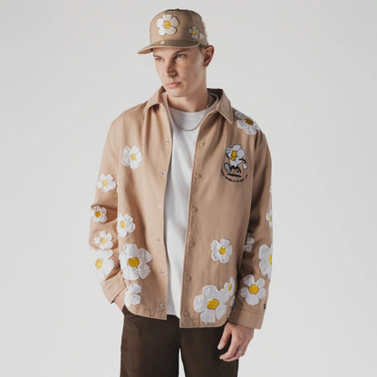 The Male model is wearing  New Era x Rodrigo Roji Flower Light Beige Jacket  1