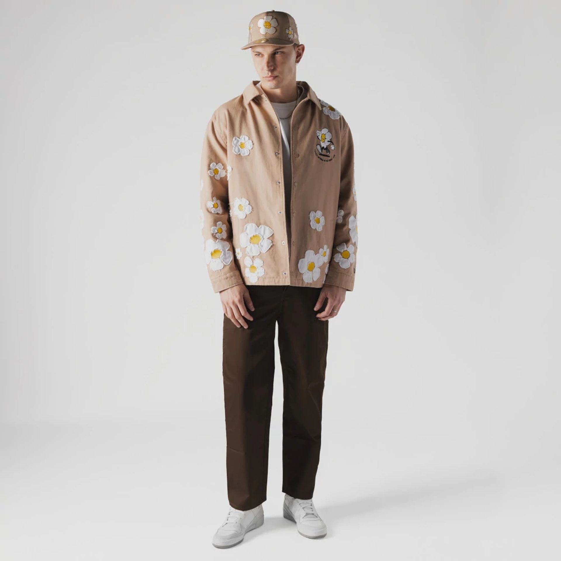 The Male model is wearing  New Era x Rodrigo Roji Flower Light Beige Jacket  4