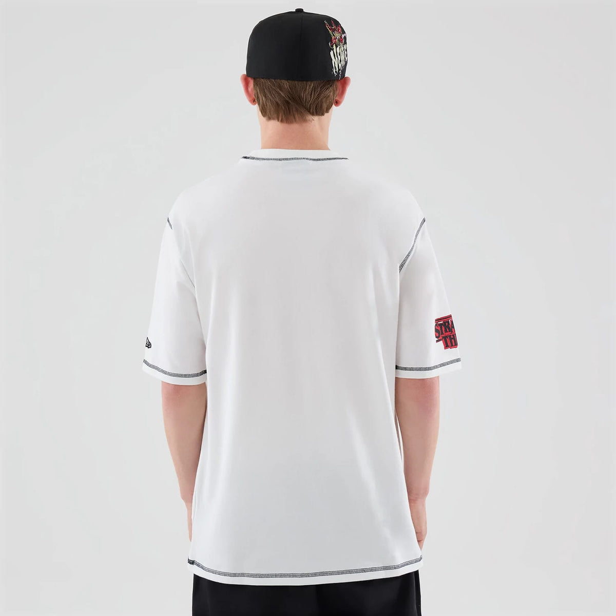 The Male model is wearing Stranger Things White Oversized T-Shirt 2