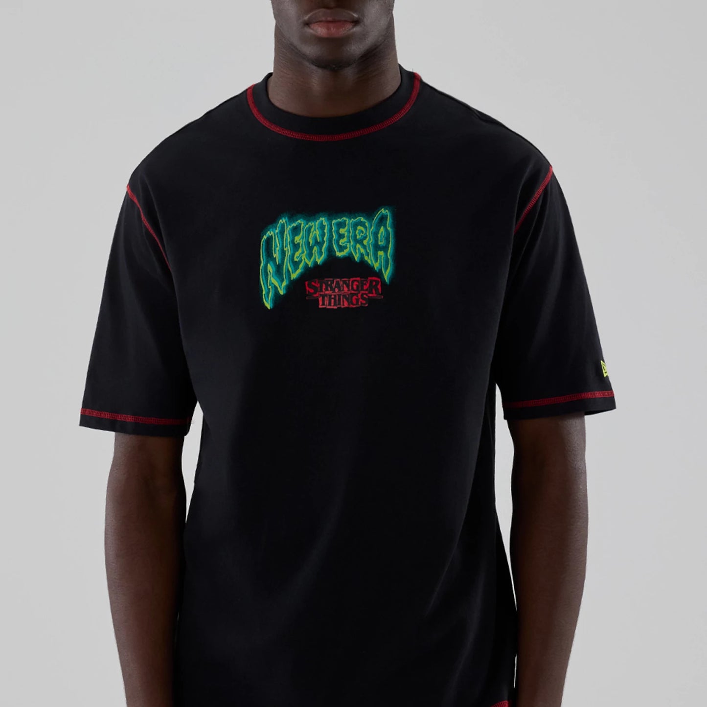 The Male model is wearing Stranger Things Black Oversized T-Shirt 3