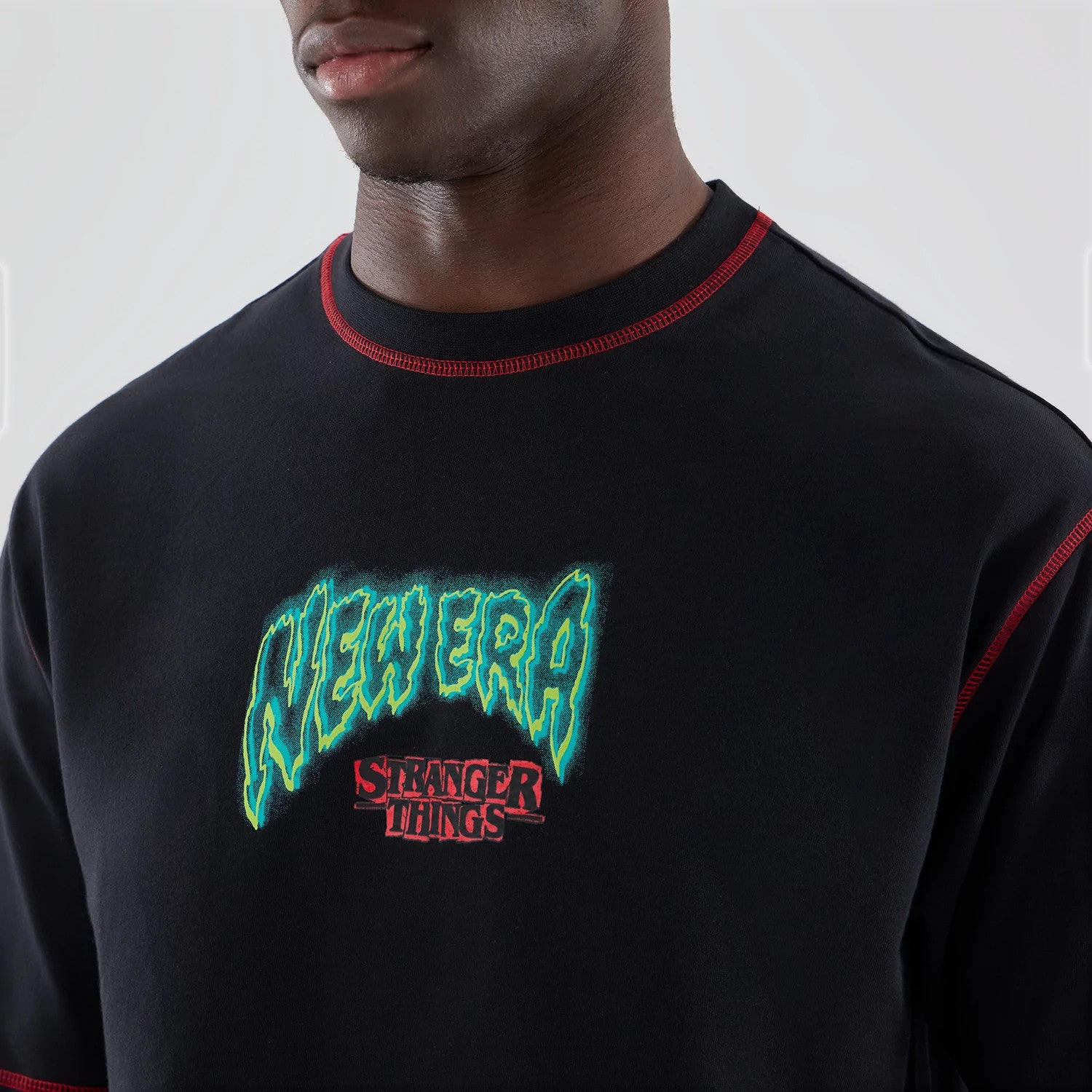 The Male model is wearing Stranger Things Black Oversized T-Shirt 6