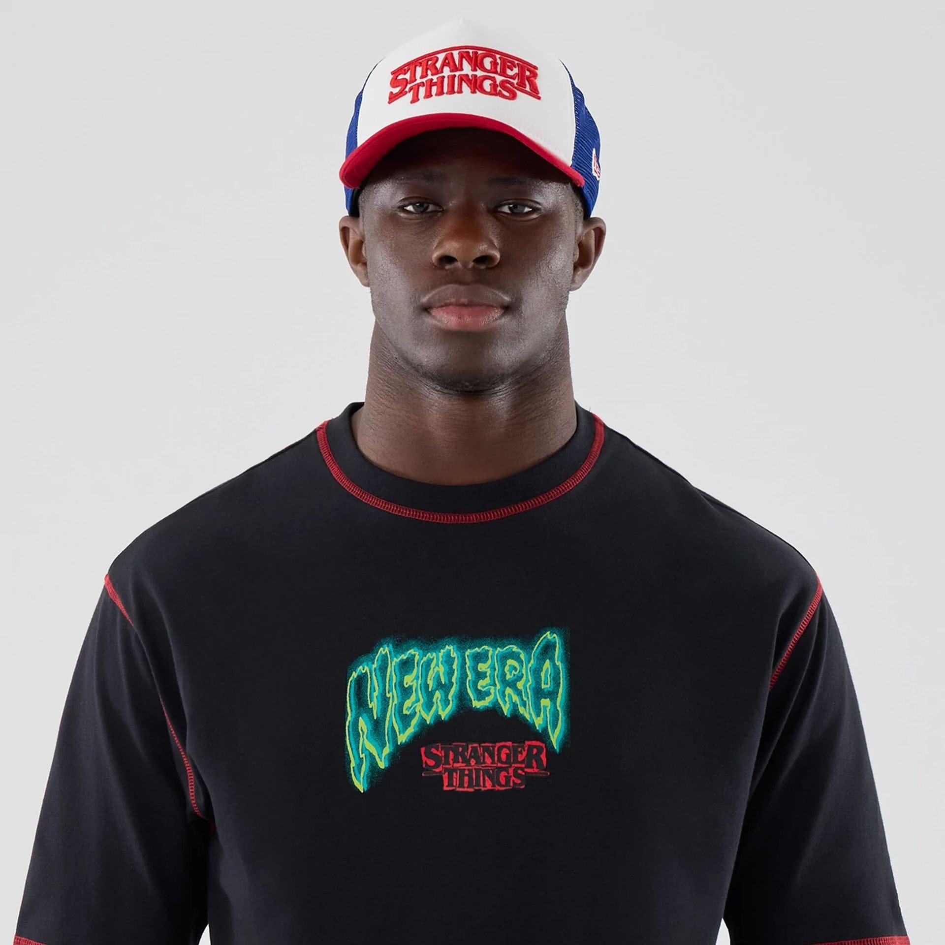 The Male model is wearing Stranger Things Black Oversized T-Shirt  7