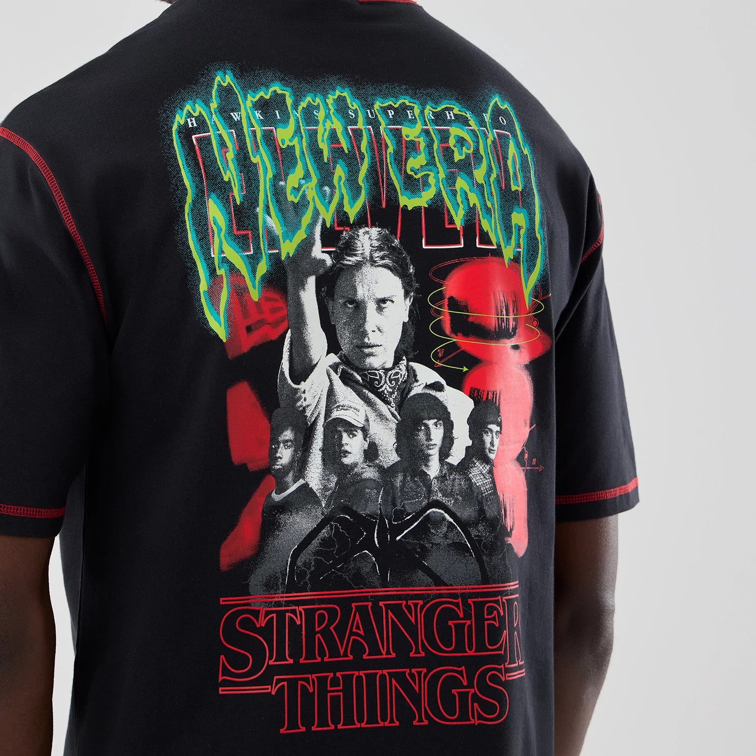The Male model is wearing Stranger Things Black Oversized T-Shirt 4
