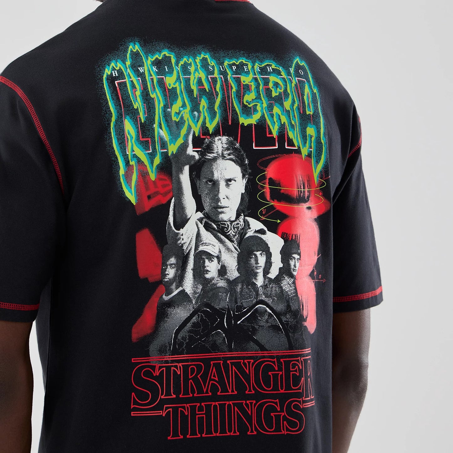 The Male model is wearing Stranger Things Black Oversized T-Shirt 4