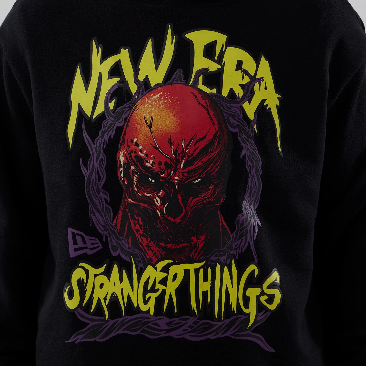 The Male model is wearing Stranger Things Black Oversized Pullover Hoodie 3