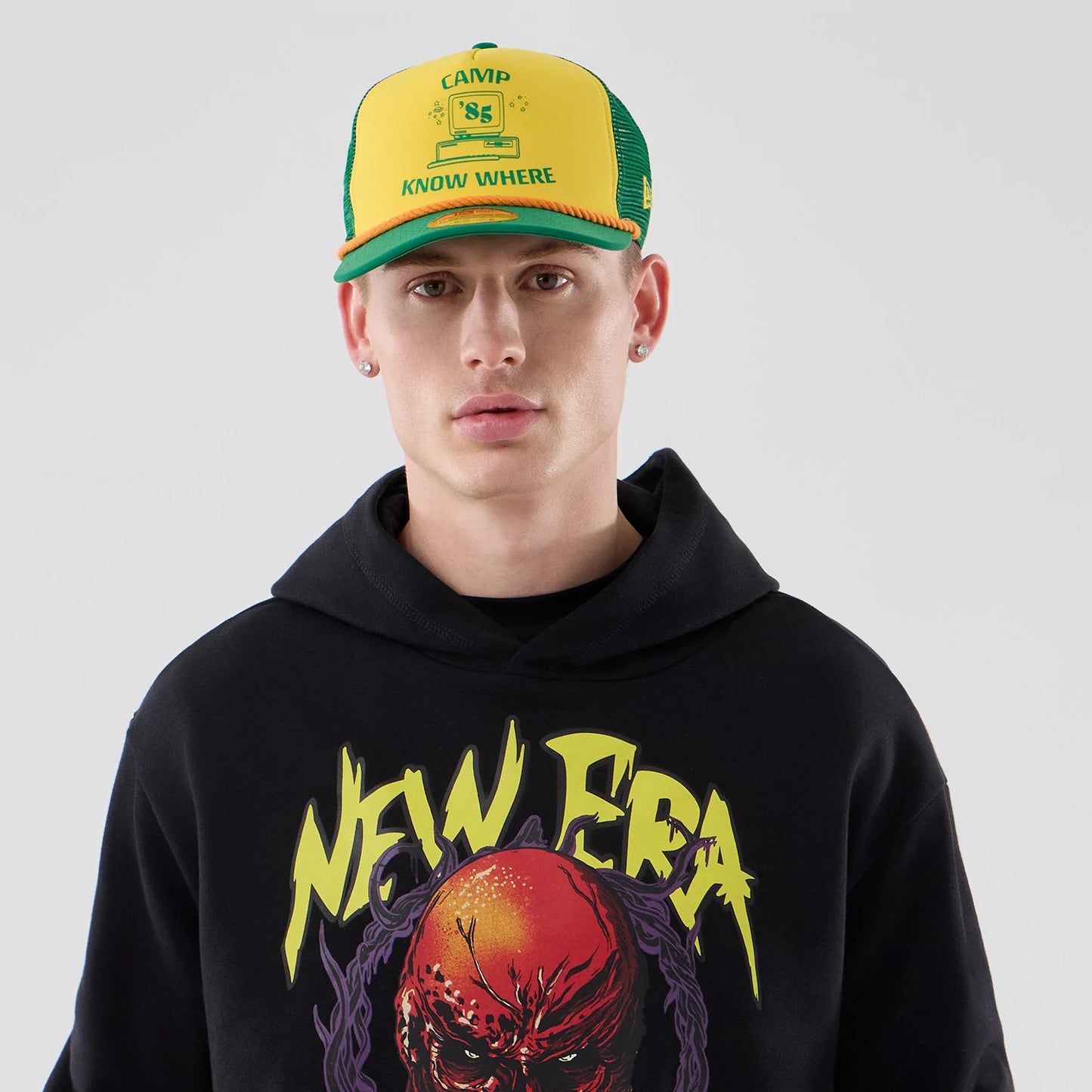The Male model is wearing Stranger Things Black Oversized Pullover Hoodie 4
