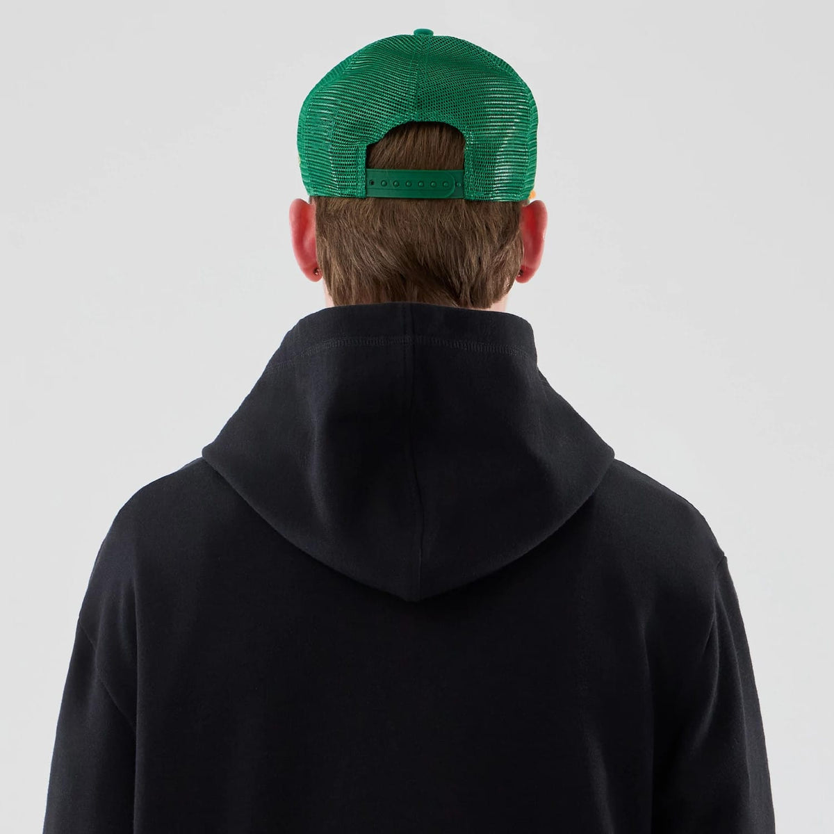 The Male model is wearing Stranger Things Black Oversized Pullover Hoodie 7
