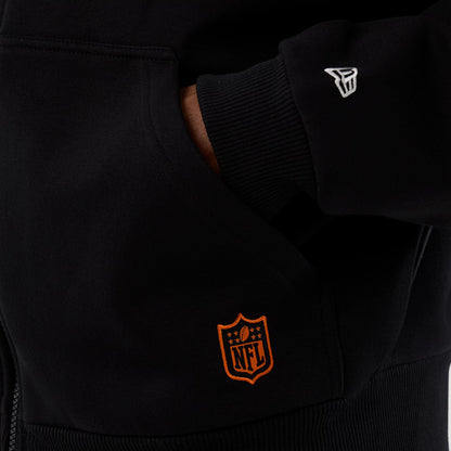 New Era Cleveland Browns NFL International Series Games Black Full Zip Hoodie, front view showing an orange embroidered NFL logo near the pocket and a white embroidered New Era logo on the sleeve cuff.
