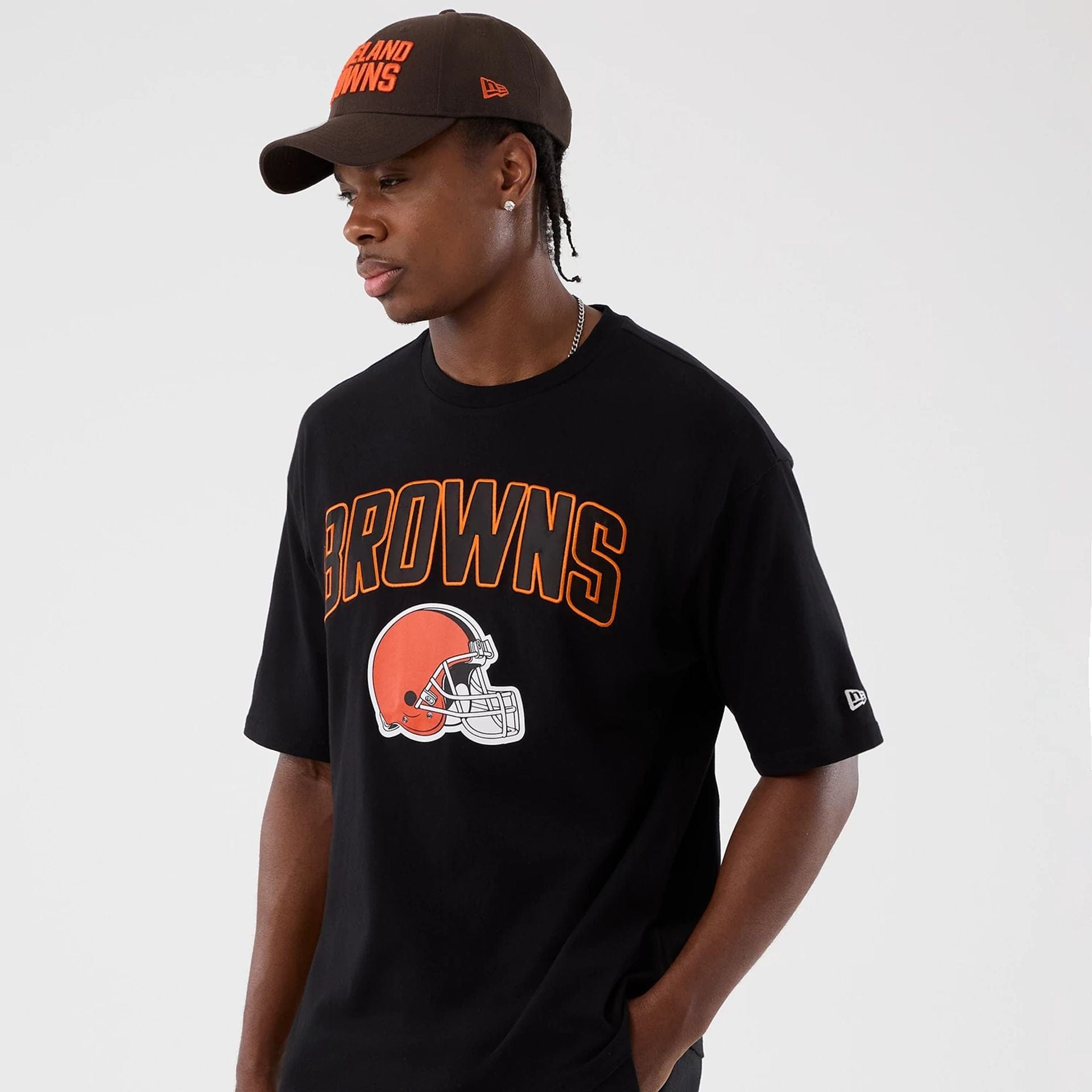 The Male model is wearing Cleveland Browns NFL International Series Games Black Oversized T-Shirt  6