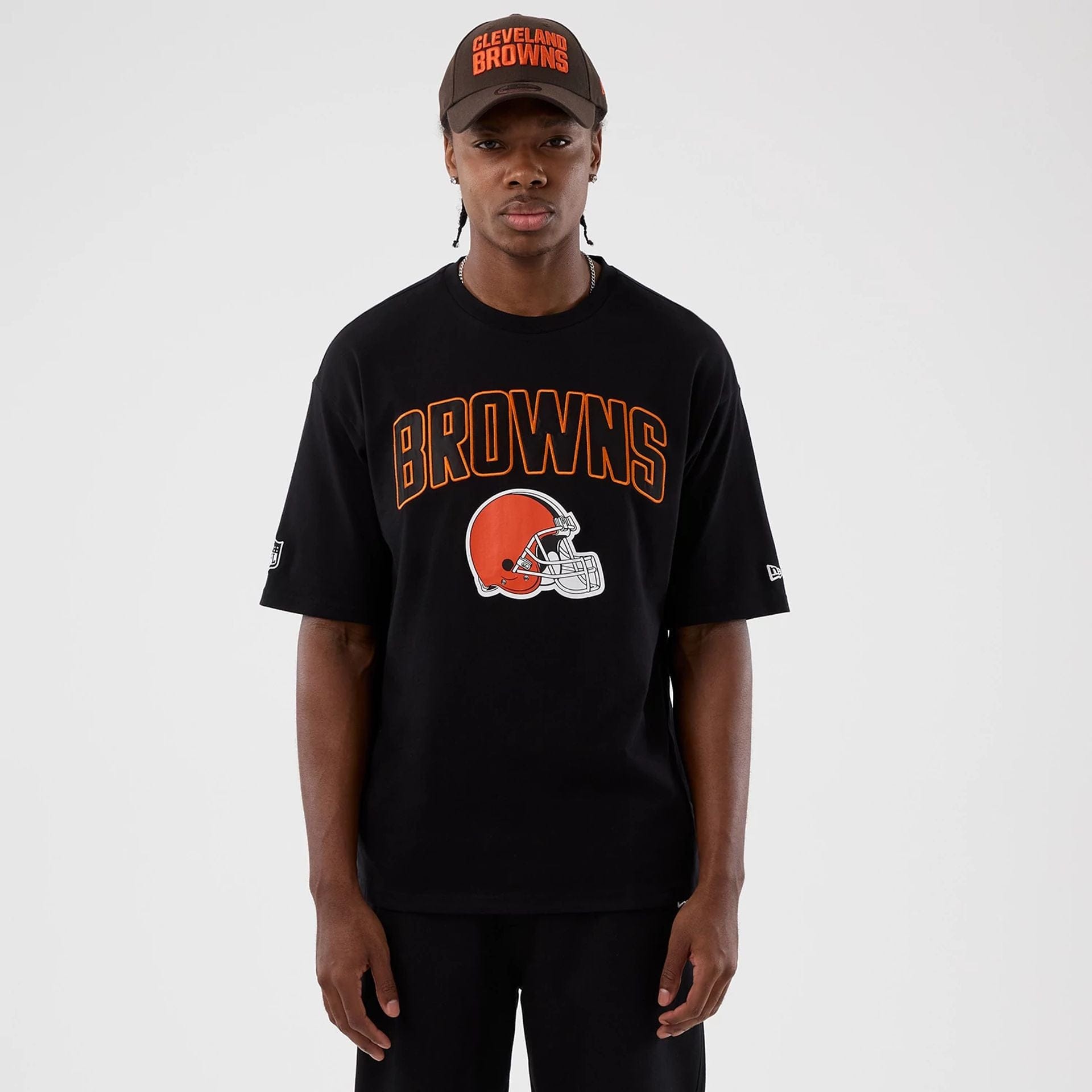 The Male model is wearing Cleveland Browns NFL International Series Games Black Oversized T-Shirt  1
