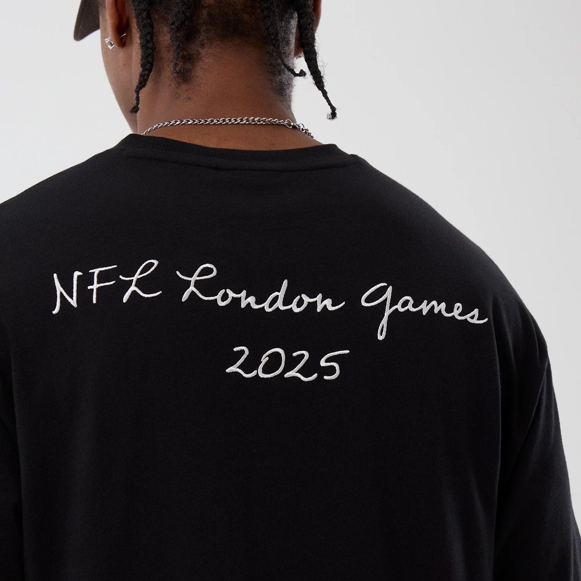 The Male model is wearing Cleveland Browns NFL International Series Games Black Oversized T-Shirt  7