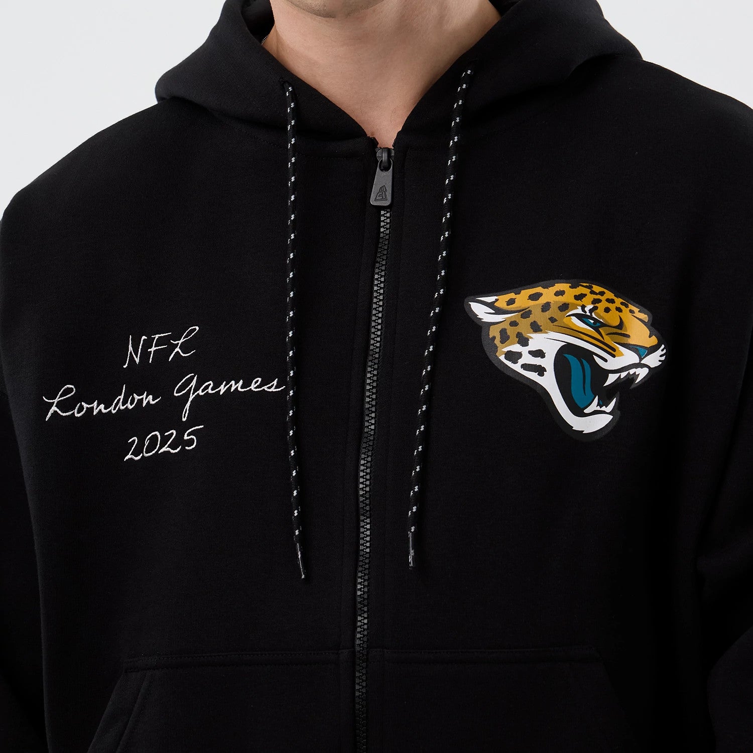 The Male model is wearing Jacksonville Jaguars NFL International Series Games Black Full Zip Hoodie 3