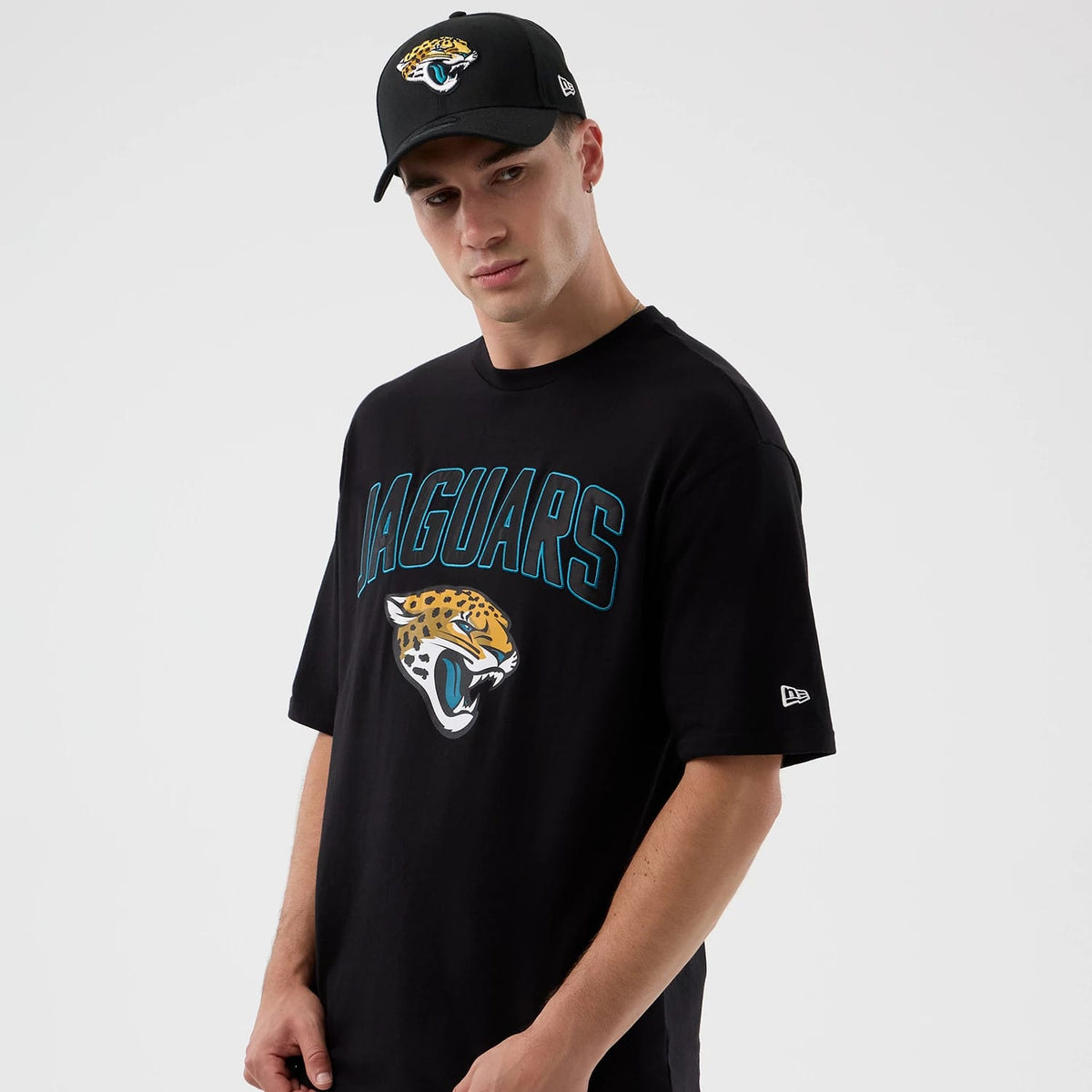 The Male model is wearing Jacksonville Jaguars NFL International Series Games Script Black Oversized T-Shirt 6