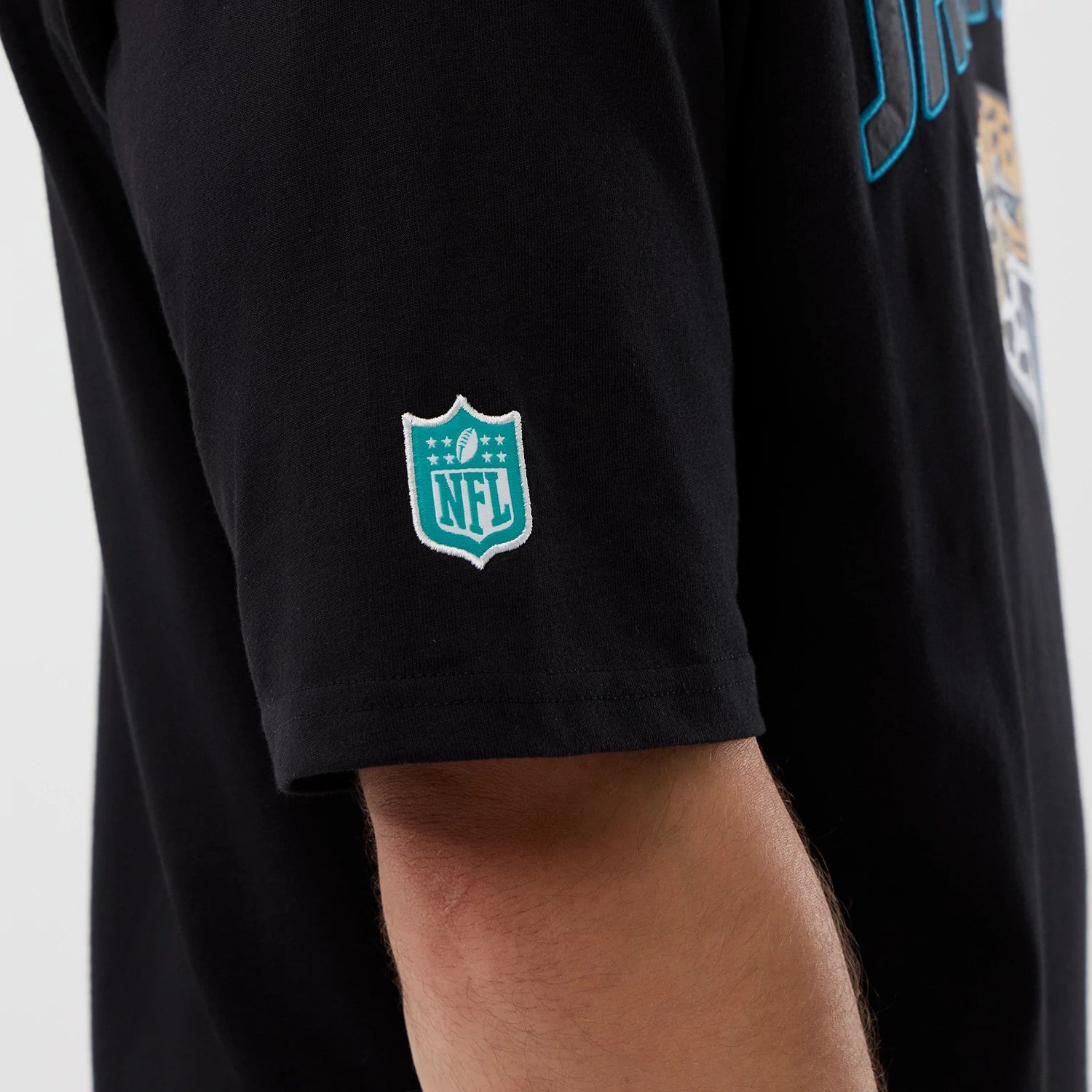 The Male model is wearing Jacksonville Jaguars NFL International Series Games Script Black Oversized T-Shirt 4