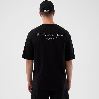 New Era Jaguars NFL International Series Games Script Black Oversized T-Shirt, back view on-model with NFL London Games 2025 script embroidered across the upper back, styled with a matching black cap.