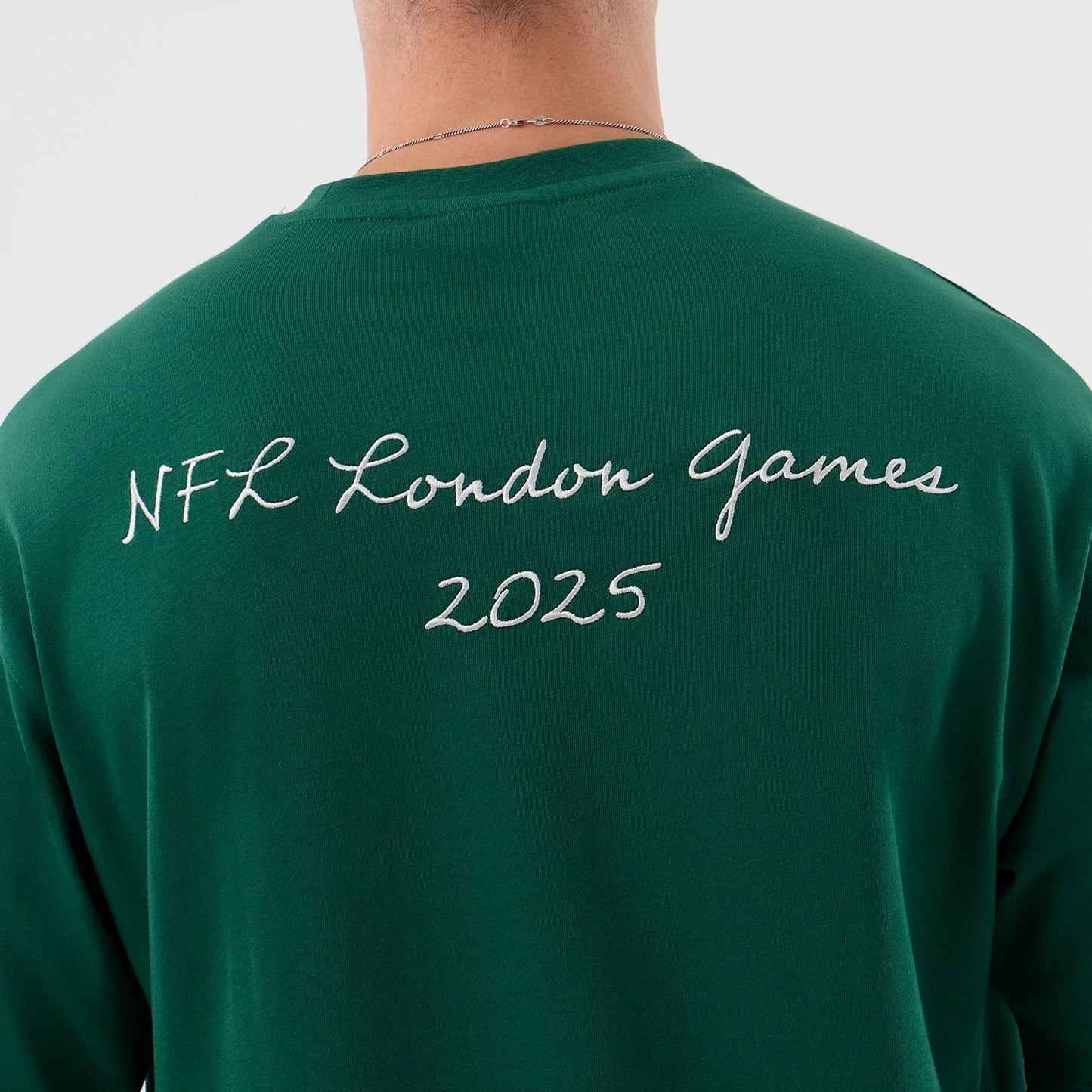 The Male model is wearing New York Jets NFL International Series Games Green Oversized T-Shirt  7