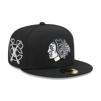 Pictured is this NHL Evergreen Chicago Blackhawks 59FIFTY Fitted cap in black. 1