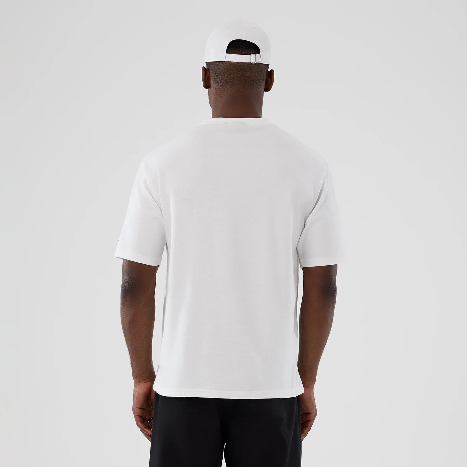 The Male model is wearing  New Era Halloween Skull Graphic White Oversized T-Shirt 2