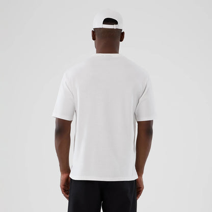 The Male model is wearing  New Era Halloween Skull Graphic White Oversized T-Shirt 2