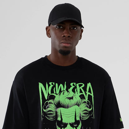 The Male model is wearing  New Era Halloween Clown Graphic Black Oversized T-Shirt 6