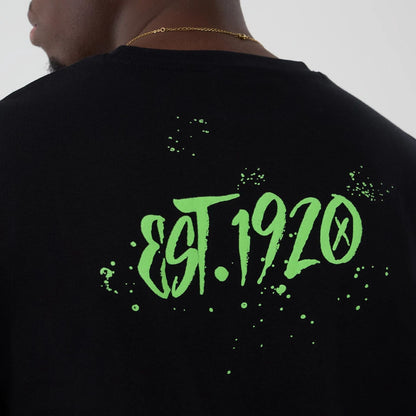 The Male model is wearing  New Era Halloween Clown Graphic Black Oversized T-Shirt  4