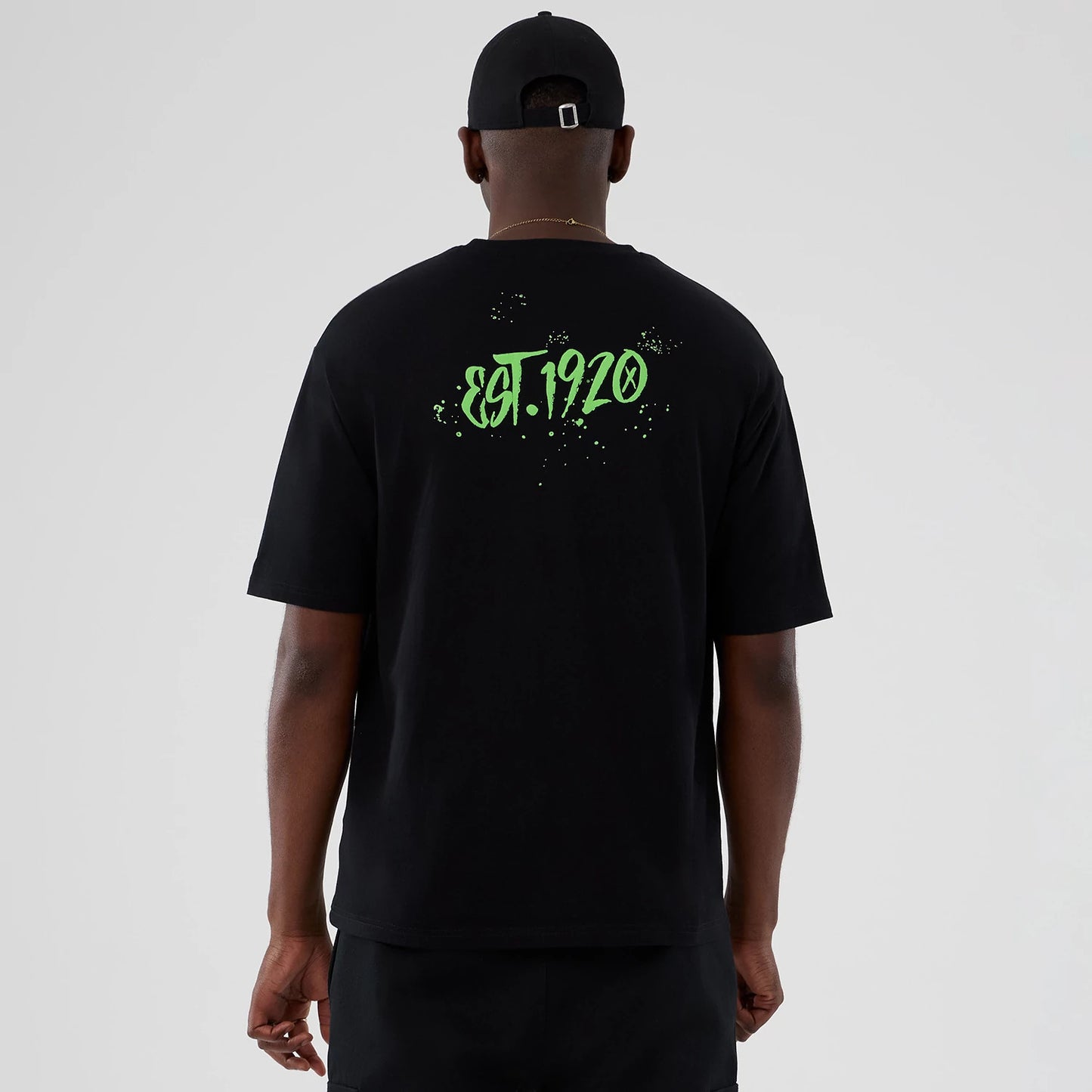 The Male model is wearing  New Era Halloween Clown Graphic Black Oversized T-Shirt 2