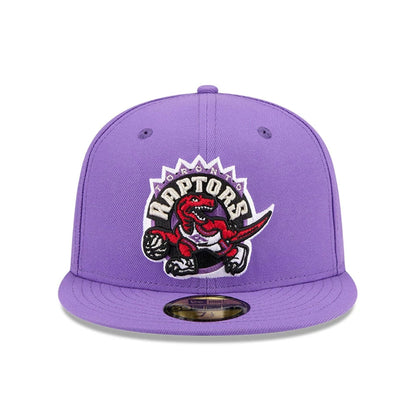Pictured is this NBA Hardwood Classic Toronto Raptors 59FIFTY Fitted cap in bright purple. 3