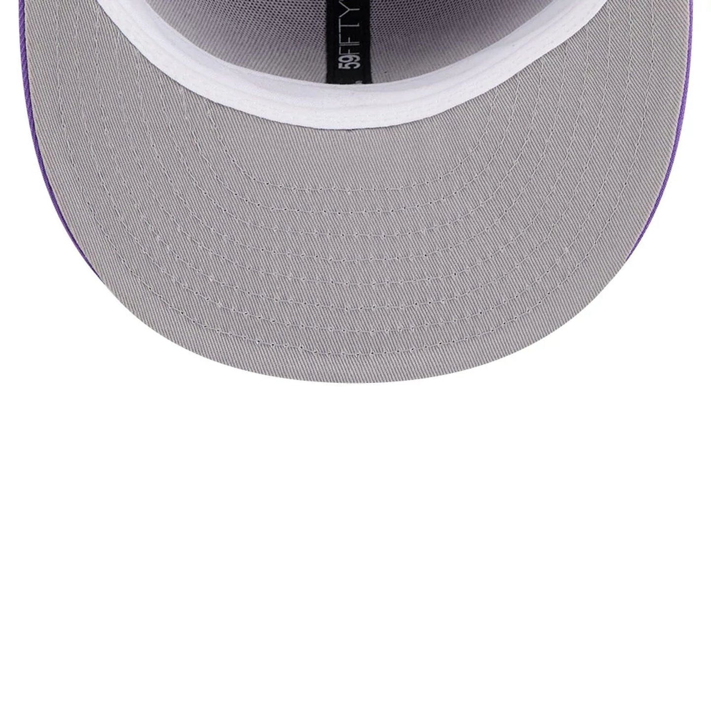 Pictured is this NBA Hardwood Classic Toronto Raptors 59FIFTY Fitted cap in bright purple. 2