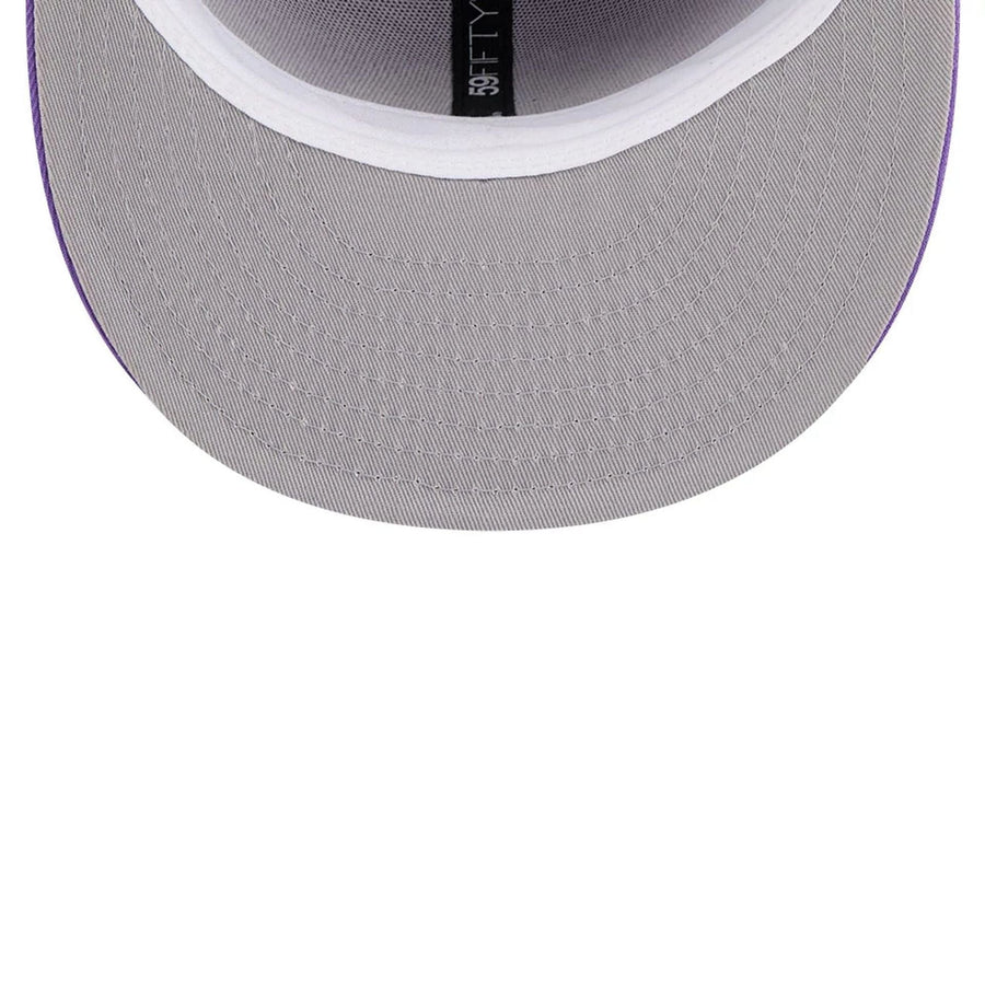 Pictured is this NBA Hardwood Classic Toronto Raptors 59FIFTY Fitted cap in bright purple. 2
