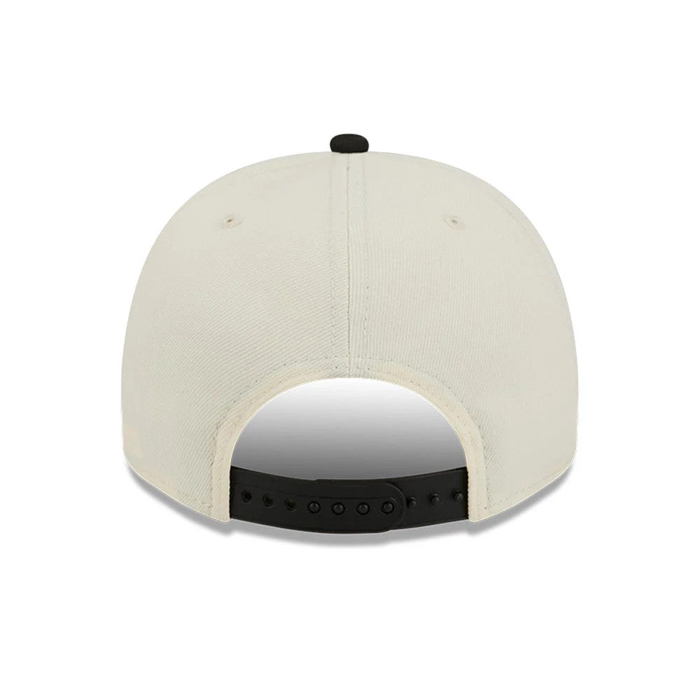 Milwaukee Bucks NBA Black New Era 9FIFTY A-Frame Snapback Adjustable Cap, rear view showing the black adjustable snap closure and a black top button on the cream-coloured crown, with matching eyelets and joined panels.