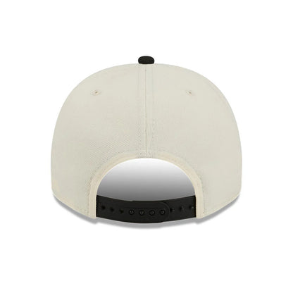 Milwaukee Bucks NBA Black New Era 9FIFTY A-Frame Snapback Adjustable Cap, rear view showing the black adjustable snap closure and a black top button on the cream-coloured crown, with matching eyelets and joined panels.