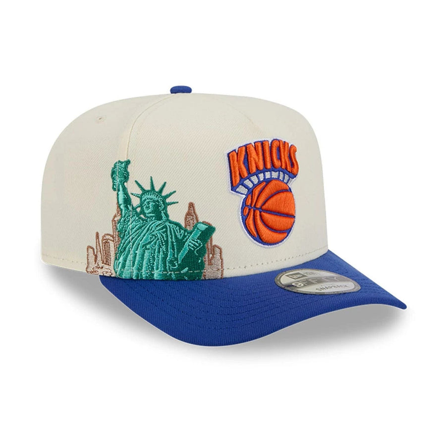 Pictured is this NBA Hardwood Classic New York Knicks 9FIFTY A-Frame Snapback cap in blue. 1