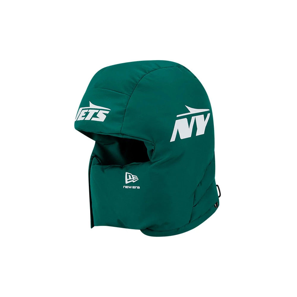 New Era New York Jets NFL Puffer Helmet Green Trapper Hat, side view showing white Jets and NY logos on the green fabric, with a New Era flag logo positioned at the chin area and a padded design for warmth.