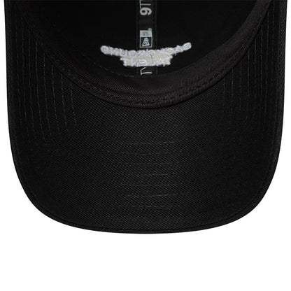 New Era Slogan Background Talent Black 9TWENTY Adjustable Cap, inside view showing the black undervisor, detailed white text on the reverse side of the front panel, and the black sweatband with a white New Era tag along the seam.